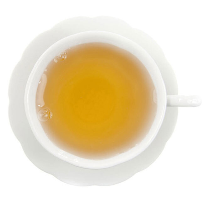 Pomegranate Hibiscus Green Tea in a cup