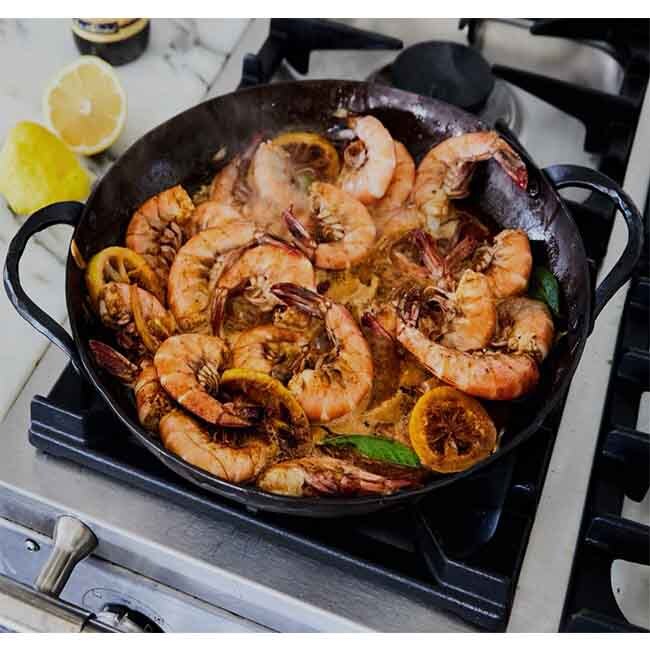 Smithey Ironware Carbon Steel Farmhouse Round Roaster in use