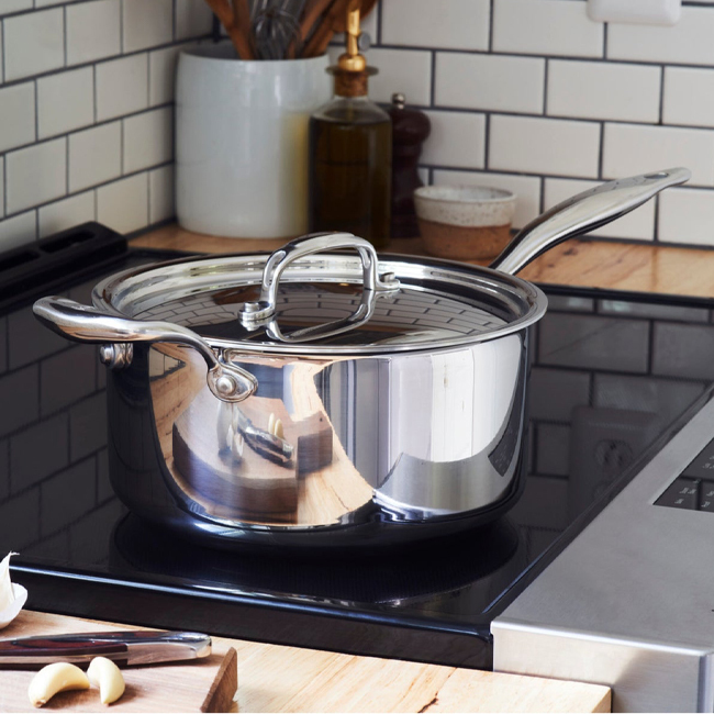 Heritage Steel 'Titanium Series' 4 Qt. Saucepan with Lid on stovetop