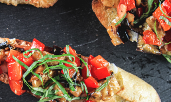 Bruschetta with Eggplant, Red Pepper, Tomatoes, and Goat Cheese