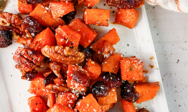 Maple Cayenne Sweet Potatoes with Cranberries and Candied Pecans