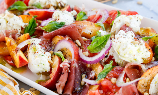 Peach and Tomato Caprese Salad with Pine Nuts, Prosciutto, and Tarragon Oil