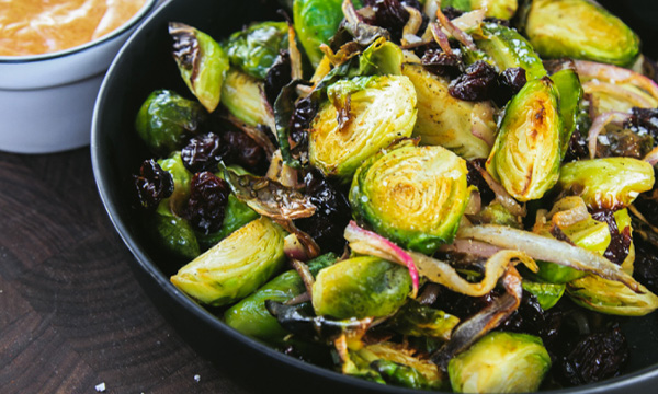 Roasted Brussels Sprouts with Red Onions, Dried Cherries and Chili Aioli