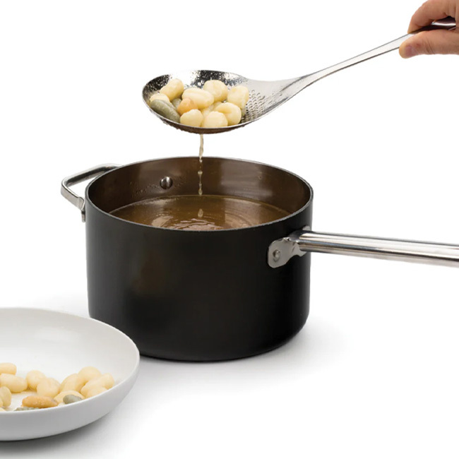 RSVP International Endurance® Pierced Straining Spoon in use