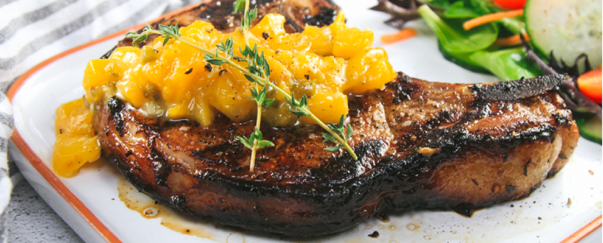 Marinated Bone-in Pork Chops on the Grill with a Spicy Peach Sauce
