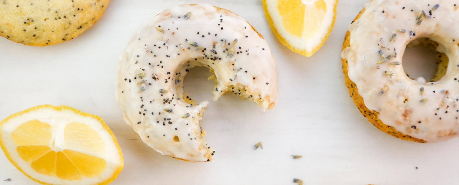 Lemon Poppyseed Doughnuts with Almond Icing